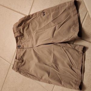 Under Armour boys golf shorts.  Size S. Excellent condition. Tan.